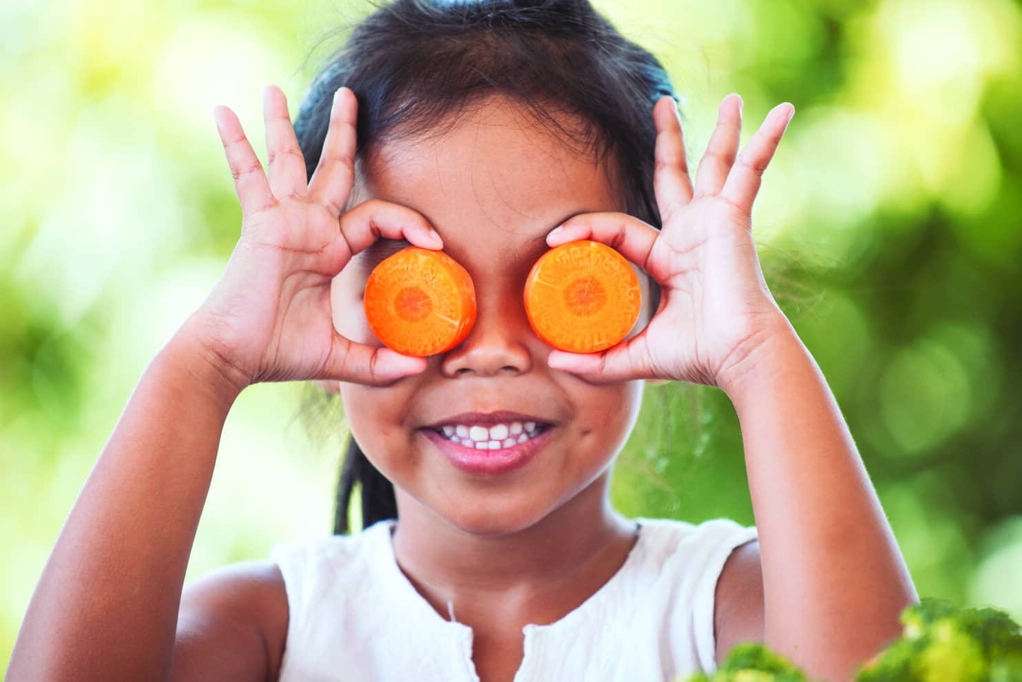 asian girl having fun to learn about vegetables with happiness