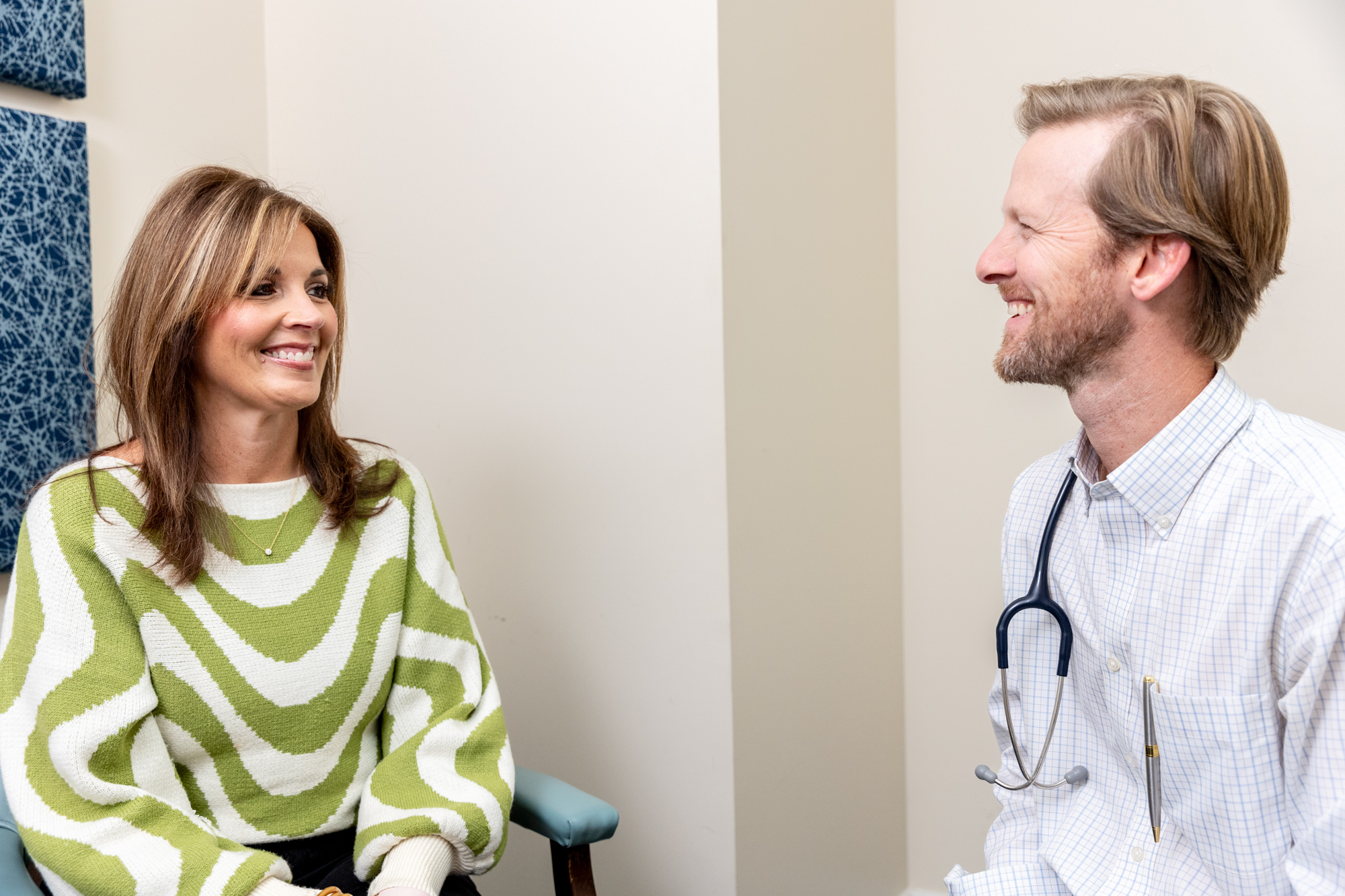 A provider at Caroline Concierge Care sits with a patient, discussing her options for cancer testing in Sumter County. Together, they review her options and best choices for testing.
